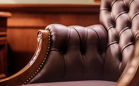 Elegant brown leather sofa in a stylish room, highlighting the benefits of leather furniture services in Charlotte, NC