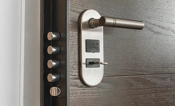 Close-up of a modern lock on a door, highlighting commercial lock installation solutions in Charlotte, NC.
