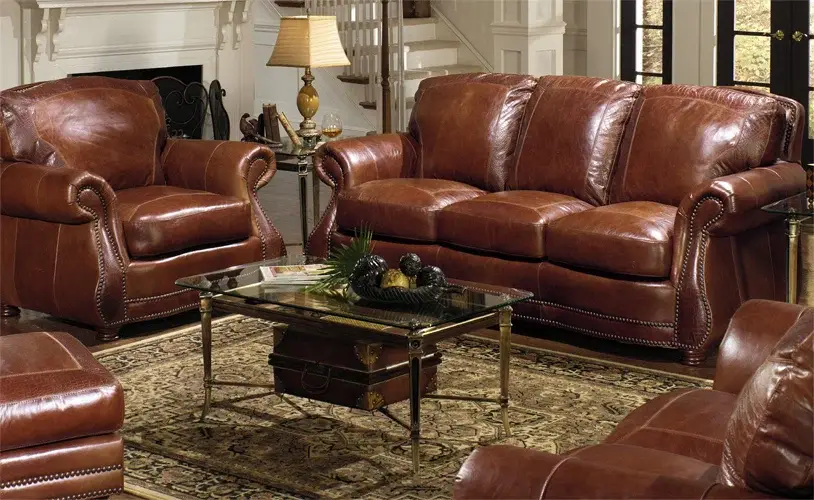 Elegant leather furniture set in a classic Charlotte, NC living room, featuring rich brown tones and traditional design.