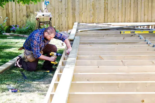 The man is assembling the deck in Weddington, NC.