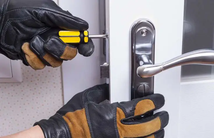 A worker is installing lock in Fort Mill, NC.