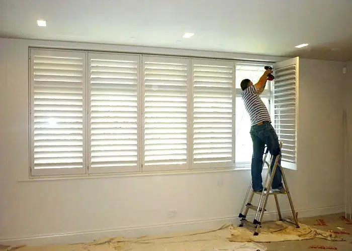 The man is repairing window grilles in Waxhaw, NC.